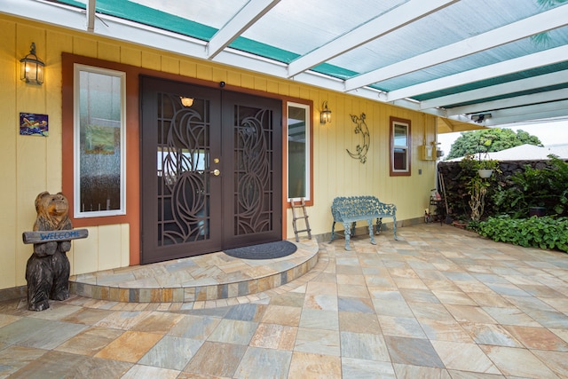 entrance to property featuring french doors