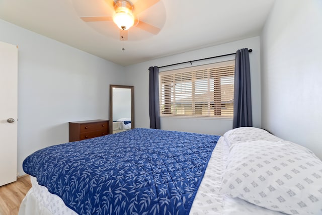 bedroom featuring hardwood / wood-style flooring and ceiling fan