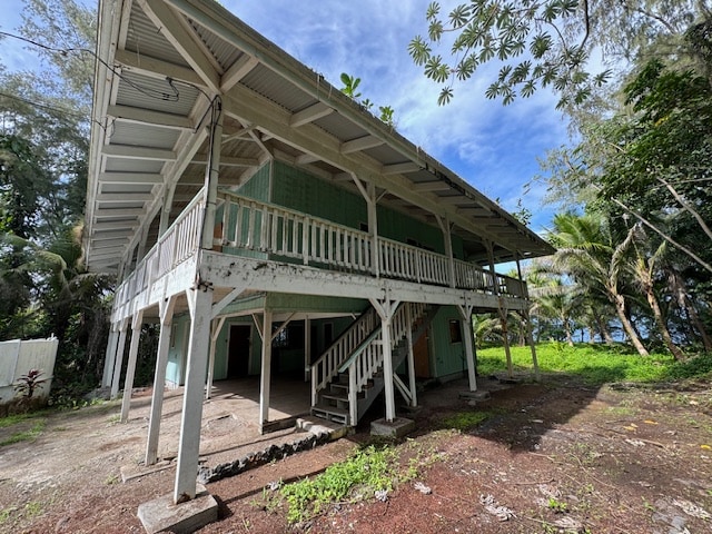 back of house featuring a deck