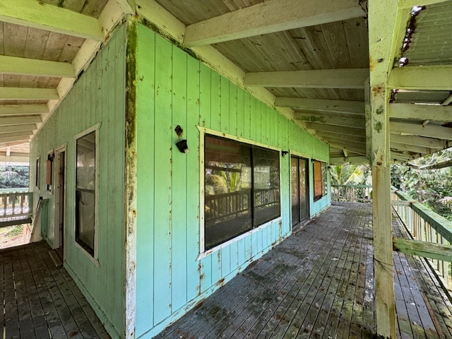 view of side of home featuring a wooden deck