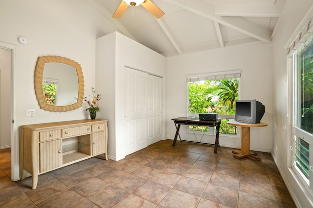 office with beamed ceiling, a wealth of natural light, ceiling fan, and high vaulted ceiling