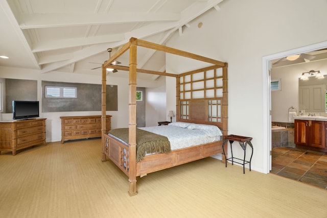 bedroom with beamed ceiling, ensuite bathroom, ceiling fan, high vaulted ceiling, and light wood-type flooring