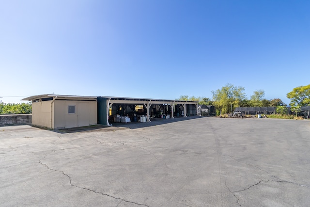 exterior space with a carport