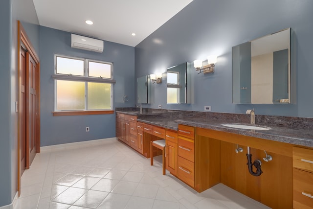 bathroom featuring a wall mounted air conditioner, vanity, and tile patterned floors