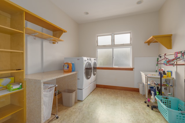 laundry area with washing machine and clothes dryer