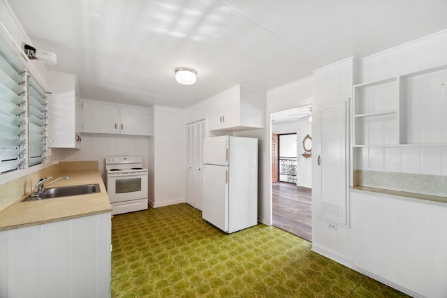 kitchen with white cabinets, ceiling fan, white appliances, and sink