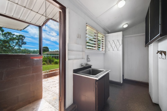 kitchen with sink and vaulted ceiling