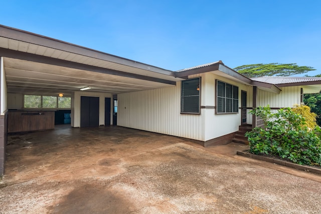 view of home's exterior featuring a carport