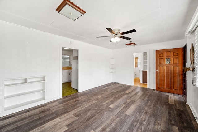 interior space with ceiling fan and dark hardwood / wood-style flooring