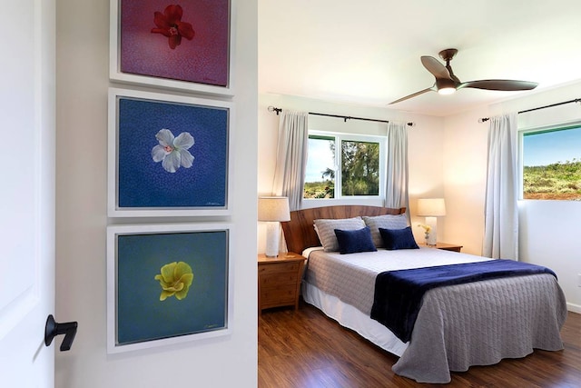 bedroom featuring ceiling fan and dark hardwood / wood-style flooring