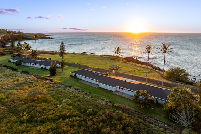 aerial view at dusk with a water view