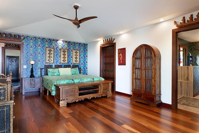 bedroom featuring ceiling fan, dark hardwood / wood-style floors, and vaulted ceiling