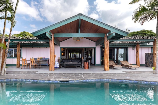 view of swimming pool featuring an outdoor living space, a patio, and ceiling fan