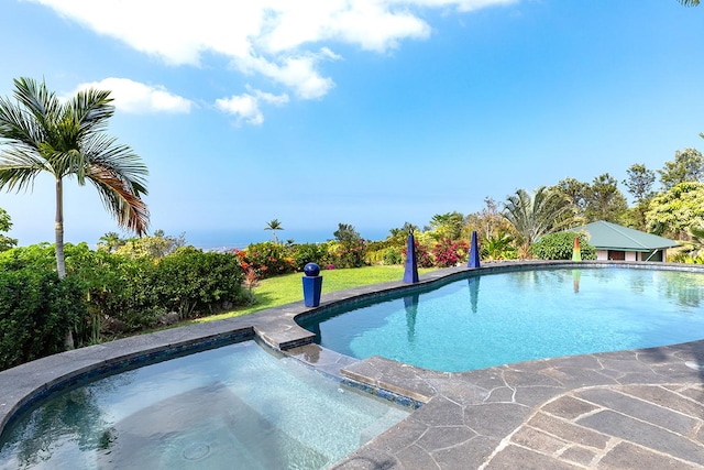 view of pool with an in ground hot tub