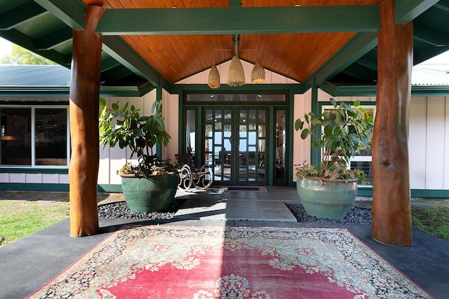 view of exterior entry featuring french doors