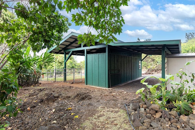 view of outbuilding with a carport