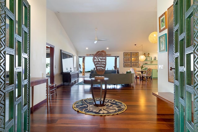 foyer entrance with dark hardwood / wood-style floors, high vaulted ceiling, and ceiling fan