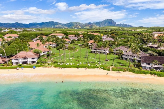 birds eye view of property with a beach view and a water and mountain view