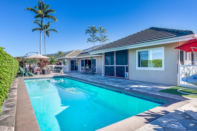 view of swimming pool with a patio