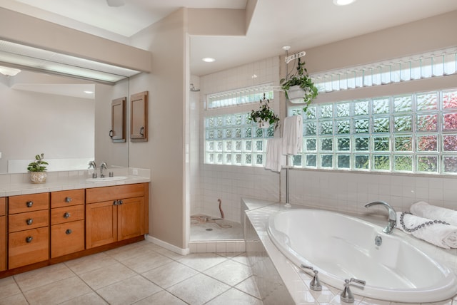 bathroom with vanity, tile patterned floors, and independent shower and bath