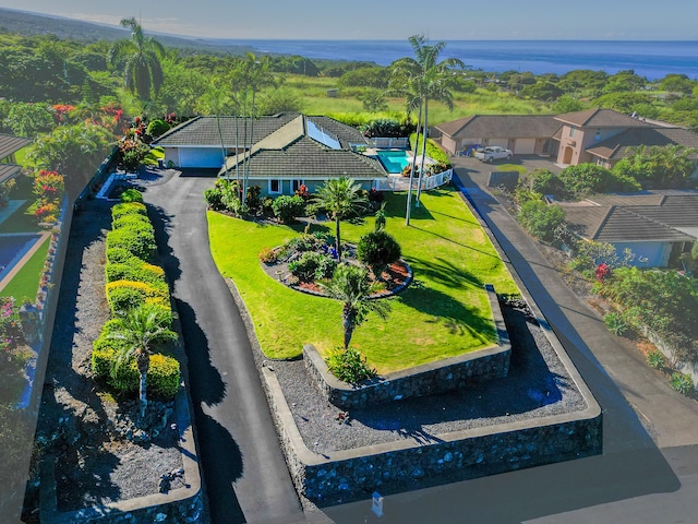 birds eye view of property with a water view