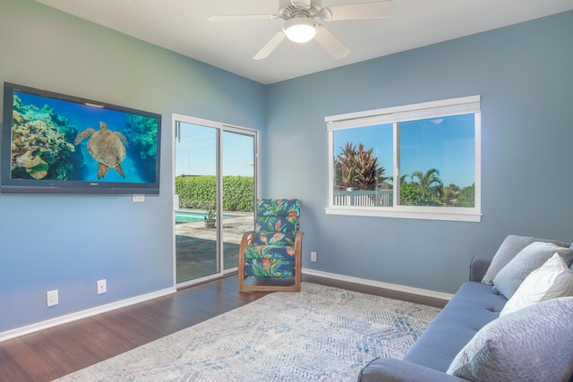 sitting room featuring hardwood / wood-style floors and ceiling fan