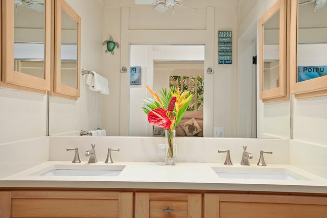 bathroom featuring vanity and ceiling fan