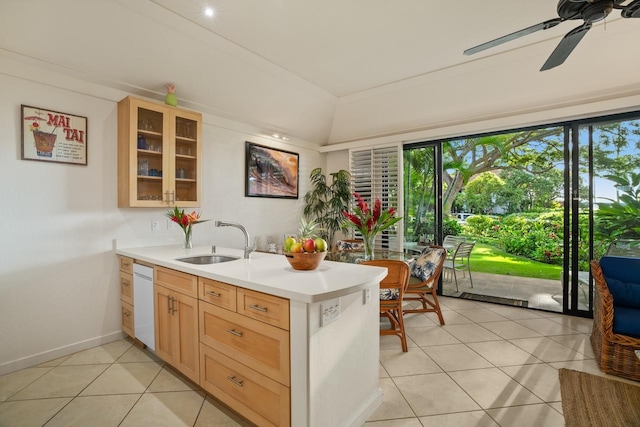 kitchen featuring dishwasher, sink, ceiling fan, light brown cabinetry, and light tile patterned flooring