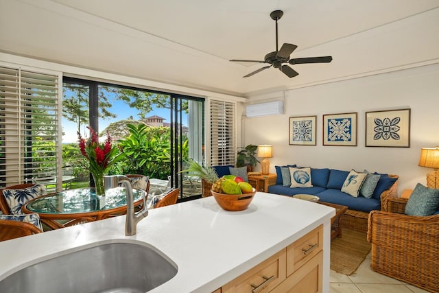 kitchen with light brown cabinets, sink, ceiling fan, light tile patterned floors, and a wall unit AC