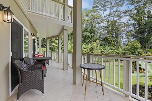 view of patio featuring a balcony