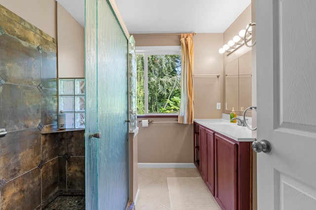 bathroom featuring tile patterned flooring and vanity