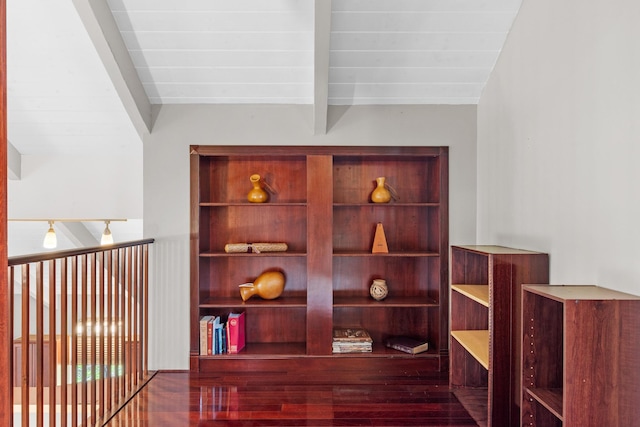 room details featuring beamed ceiling and hardwood / wood-style flooring