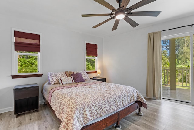 bedroom with access to outside, light hardwood / wood-style flooring, and ceiling fan