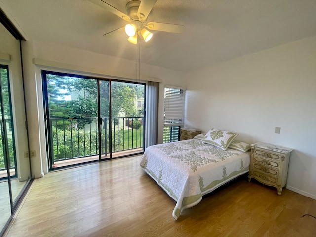 bedroom with ceiling fan, light hardwood / wood-style flooring, and access to outside