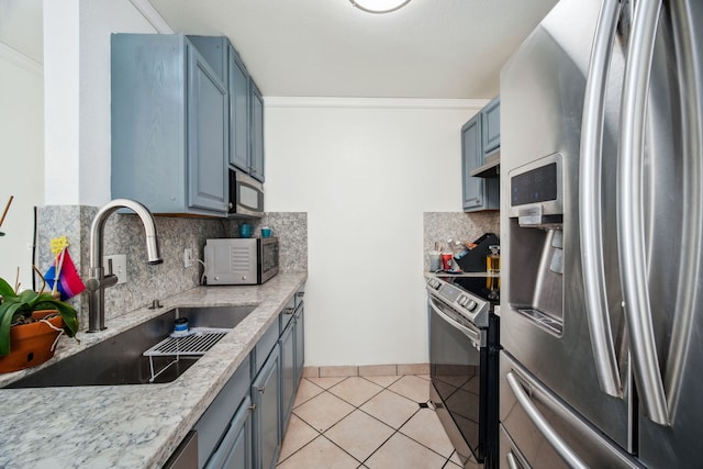 kitchen with sink, stainless steel appliances, tasteful backsplash, crown molding, and light tile patterned flooring