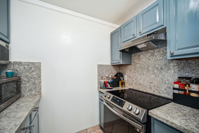 kitchen featuring decorative backsplash, light tile patterned floors, stainless steel appliances, and blue cabinets