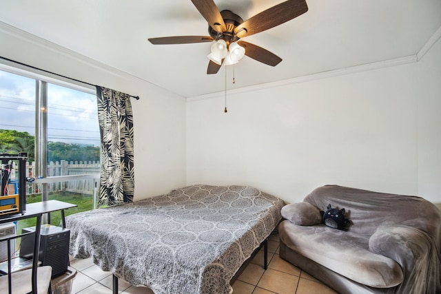 bedroom with ceiling fan, ornamental molding, and light tile patterned flooring