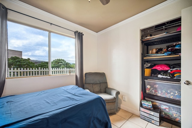 bedroom with light tile patterned flooring and crown molding