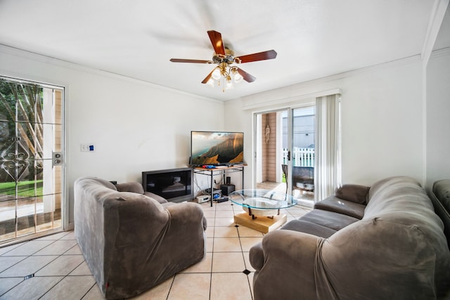 living room with ceiling fan, light tile patterned floors, and crown molding