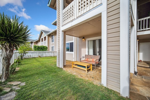 view of yard featuring a balcony