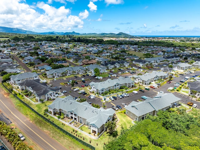 birds eye view of property with a mountain view