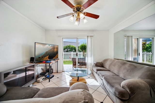 living room featuring light tile patterned floors, ceiling fan, and crown molding