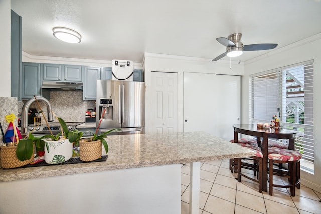 kitchen featuring ceiling fan, stainless steel fridge with ice dispenser, decorative backsplash, light tile patterned floors, and ornamental molding