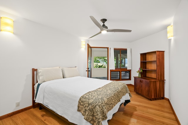 bedroom with access to outside, light wood-type flooring, and ceiling fan