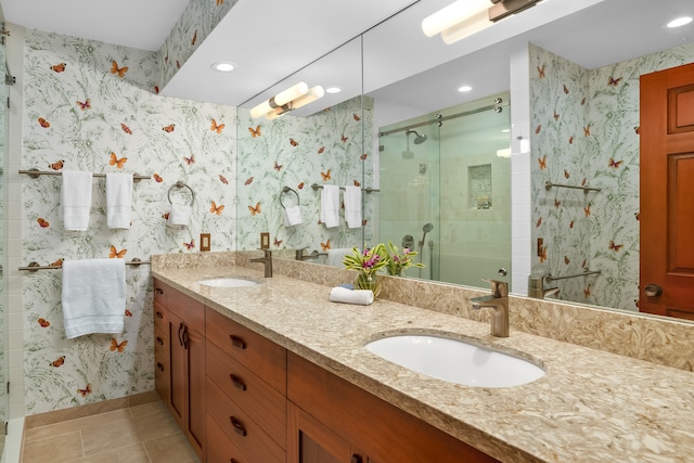 bathroom featuring vanity, tile patterned floors, and a shower with shower door