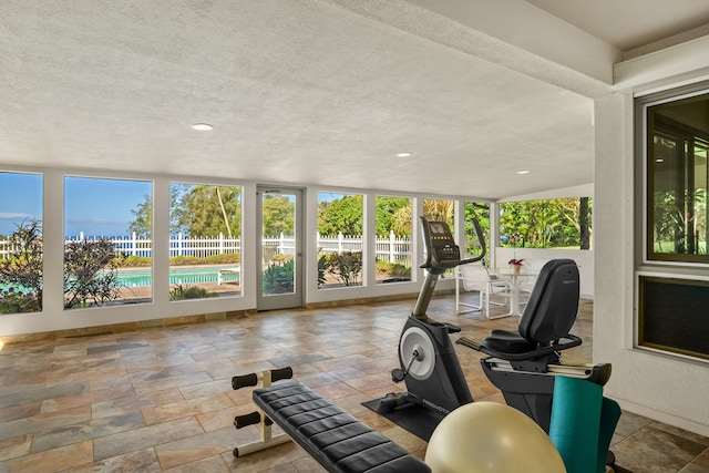 exercise area featuring a textured ceiling