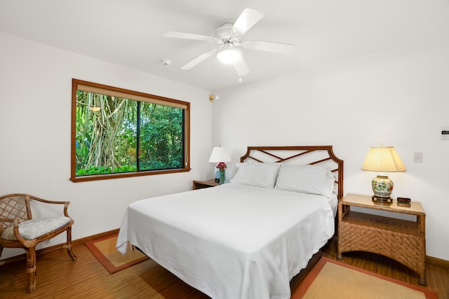 bedroom featuring hardwood / wood-style flooring and ceiling fan