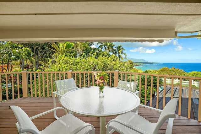 balcony featuring a deck with water view