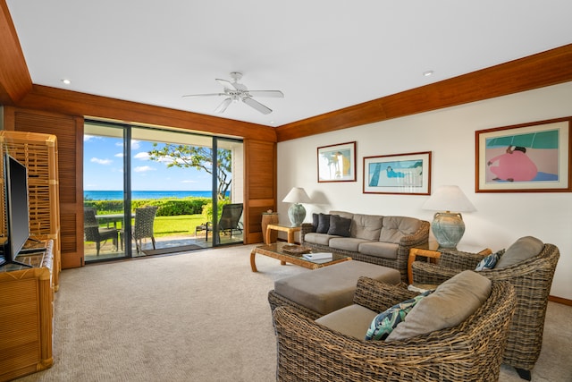 living room with ceiling fan and carpet floors