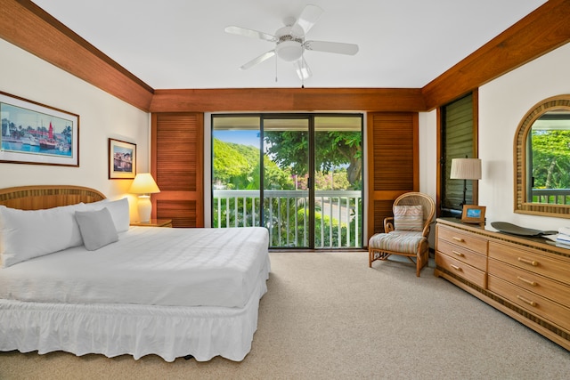 carpeted bedroom with ceiling fan, multiple windows, and access to outside